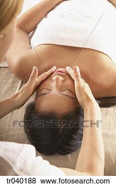 Stock Photo - woman receiving 
a facial massage. 
fotosearch - search 
stock photos, 
pictures, images, 
and photo clipart