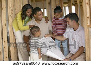 Stock Photography - young couple with 
children looking 
at a map. fotosearch 
- search stock 
photos, pictures, 
images, and photo 
clipart