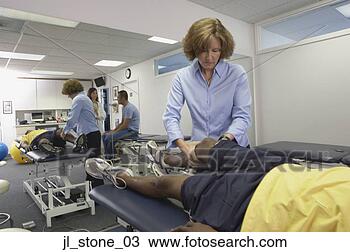 Stock Photo - arthritic patient 
undergoing physical 
therapy in a hospital. 
fotosearch - search 
stock photos, 
pictures, images, 
and photo clipart