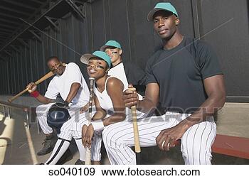 Stock Photograph - portrait of baseball 
team sitting on 
a bench. fotosearch 
- search stock 
photos, pictures, 
images, and photo 
clipart