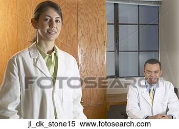 Stock Image - portrait of a 
female doctor 
with a male doctor 
smiling. fotosearch 
- search stock 
photos, pictures, 
images, and photo 
clipart