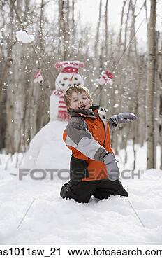 Stock Photography - boy throwing snowflakes 
on a hill. fotosearch 
- search stock 
photos, pictures, 
images, and photo 
clipart