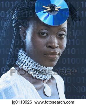 Stock Photo - close-up of a 
mid adult woman 
wearing a cd on 
her head. fotosearch 
- search stock 
photos, pictures, 
images, and photo 
clipart