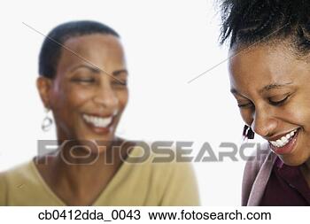 Stock Photo - close-up of a 
young woman and 
a mid adult woman 
smiling. fotosearch 
- search stock 
photos, pictures, 
images, and photo 
clipart