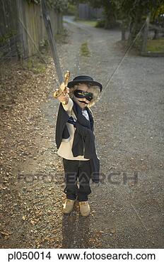Stock Photo - girl dressed wearing 
a costume and 
holding a sword. 
fotosearch - search 
stock photos, 
pictures, images, 
and photo clipart