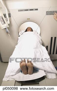 Stock Photo - high angle view 
of a female patient 
getting a mri 
scan. fotosearch 
- search stock 
photos, pictures, 
images, and photo 
clipart