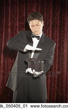 Stock Photography - magician performing 
a magic tricks 
on stage. fotosearch 
- search stock 
photos, pictures, 
images, and photo 
clipart