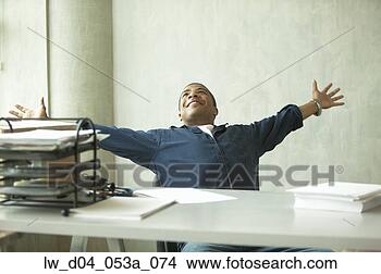 Stock Photo - man relaxing after 
work. fotosearch 
- search stock 
photos, pictures, 
images, and photo 
clipart