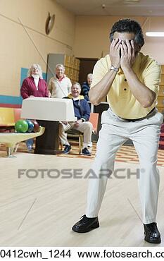 Stock Photo - mature man covering 
his face with 
his hands. fotosearch 
- search stock 
photos, pictures, 
images, and photo 
clipart