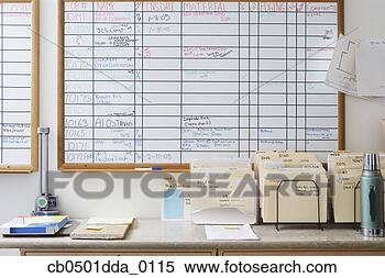 Stock Image - measuring tool 
and marbles placed 
on a table in 
front of a white 
board. fotosearch 
- search stock 
photos, pictures, 
images, and photo 
clipart