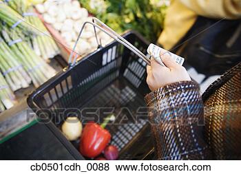 Stock Photo - mid adult woman 
shopping in a 
supermarket. fotosearch 
- search stock 
photos, pictures, 
images, and photo 
clipart