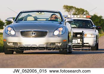 Stock Image - police car chasing 
a convertible 
car. fotosearch 
- search stock 
photos, pictures, 
images, and photo 
clipart