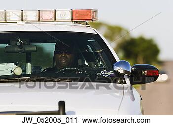 Stock Photography - police officer 
sitting in a police 
car. fotosearch 
- search stock 
photos, pictures, 
images, and photo 
clipart
