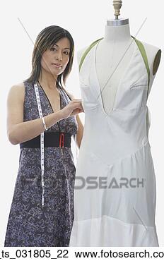 Stock Photo - portrait of a 
fashion designer 
with a mannequin. 
fotosearch - search 
stock photos, 
pictures, images, 
and photo clipart