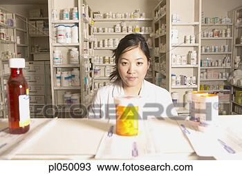 Stock Photo - portrait of a 
female pharmacist 
in a pharmacy. 
fotosearch - search 
stock photos, 
pictures, images, 
and photo clipart