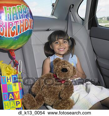 Stock Photo - portrait of a 
girl sitting in 
the back seat 
of a car with 
a teddy. fotosearch 
- search stock 
photos, pictures, 
images, and photo 
clipart