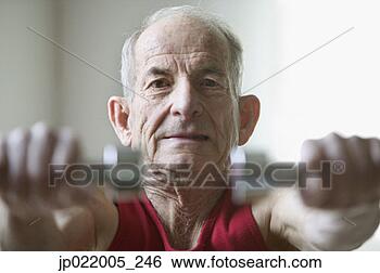 Stock Photo - portrait of a 
senior man exercising 
with dumbbells. 
fotosearch - search 
stock photos, 
pictures, images, 
and photo clipart