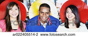 Stock Photo - portrait of two 
young women and 
a young man sitting 
in a restaurant. 
fotosearch - search 
stock photos, 
pictures, images, 
and photo clipart