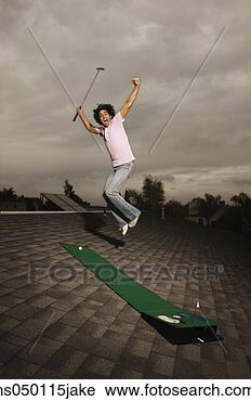 Stock Photography - portrait of a 
young man jumping. 
fotosearch - search 
stock photos, 
pictures, images, 
and photo clipart