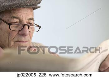 Stock Photo - senior man reading 
a newspaper. fotosearch 
- search stock 
photos, pictures, 
images, and photo 
clipart