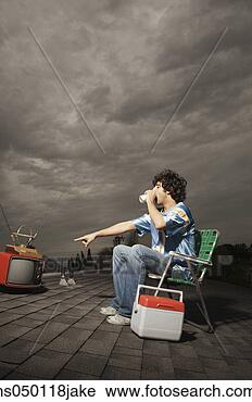 Stock Photography - side profile of 
a young man drinking 
soft drink. fotosearch 
- search stock 
photos, pictures, 
images, and photo 
clipart
