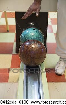 Stock Photography - two bowling balls 
in a ten pin bowling 
alley. fotosearch 
- search stock 
photos, pictures, 
images, and photo 
clipart