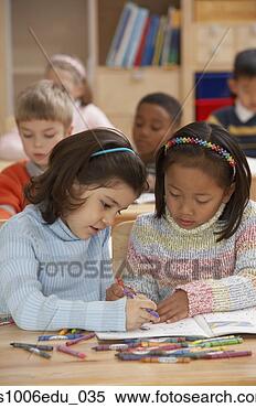 Stock Image - two students coloring 
with crayons in 
a classroom. fotosearch 
- search stock 
photos, pictures, 
images, and photo 
clipart