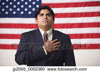 Stock Photography - businessman standing 
in front of an 
american flag 
with one hand. 
fotosearch - search 
stock photos, 
pictures, images, 
and photo clipart