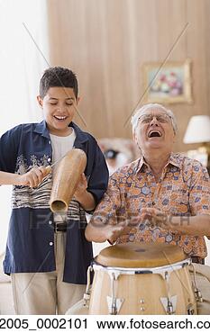 Stock Photography - older man and 
grandson playing 
percussion instruments. 
fotosearch - search 
stock photos, 
pictures, images, 
and photo clipart