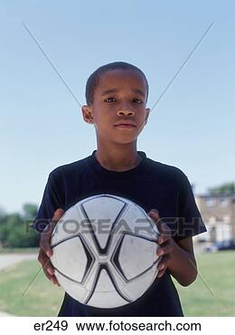 Stock Photograph - portrait of boy 
holding soccer 
ball. fotosearch 
- search stock 
photos, pictures, 
images, and photo 
clipart