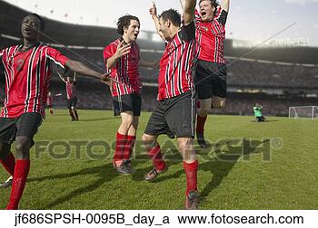 Stock Photography - soccer players 
celebrating a 
goal. fotosearch 
- search stock 
photos, pictures, 
images, and photo 
clipart