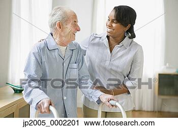 Stock Photography - woman helping 
elderly man use 
a walker. fotosearch 
- search stock 
photos, pictures, 
images, and photo 
clipart