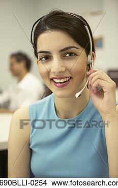 Stock Photo - young businesswoman 
talking on a headset. 
fotosearch - search 
stock photos, 
pictures, images, 
and photo clipart