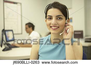 Stock Photo - young businesswoman 
talking on a headset. 
fotosearch - search 
stock photos, 
pictures, images, 
and photo clipart