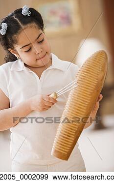 Stock Photograph - young girl playing 
percussion instrument. 
fotosearch - search 
stock photos, 
pictures, images, 
and photo clipart