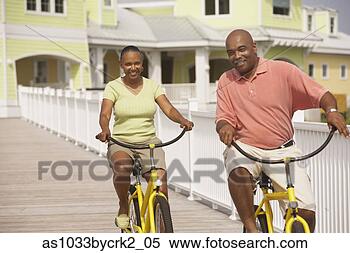 Stock Image - african american 
couple riding 
bikes. fotosearch 
- search stock 
photos, pictures, 
images, and photo 
clipart