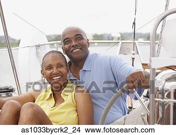 Stock Photo - african american 
couple boating. 
fotosearch - search 
stock photos, 
pictures, images, 
and photo clipart