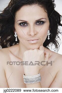 Stock Photograph - close up portrait 
of nude woman 
with diamond jewelry. 
fotosearch - search 
stock photos, 
pictures, images, 
and photo clipart