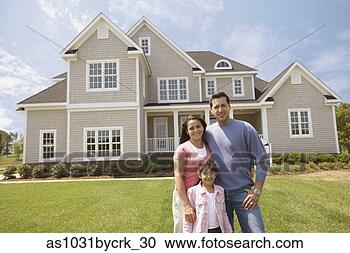Stock Photography - family standing 
in front of their 
home. fotosearch 
- search stock 
photos, pictures, 
images, and photo 
clipart