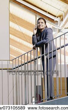 Stock Photograph - female executive 
on mobile. fotosearch 
- search stock 
photos, pictures, 
images, and photo 
clipart