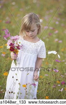 Stock Photo - girl in field 
picking wildflowers. 
fotosearch - search 
stock photos, 
pictures, images, 
and photo clipart