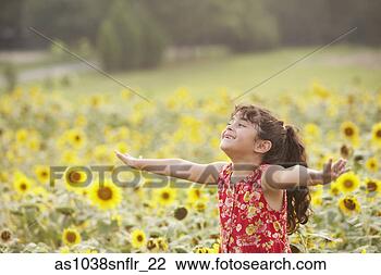 Stock Photo - girl holding arms 
out in sunflower 
field. fotosearch 
- search stock 
photos, pictures, 
images, and photo 
clipart