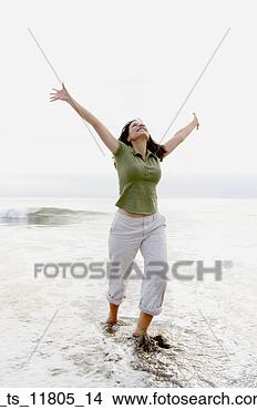 Stock Photo - joyful woman at 
beach. fotosearch 
- search stock 
photos, pictures, 
images, and photo 
clipart