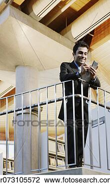 Stock Photo - male executive 
using pda. fotosearch 
- search stock 
photos, pictures, 
images, and photo 
clipart