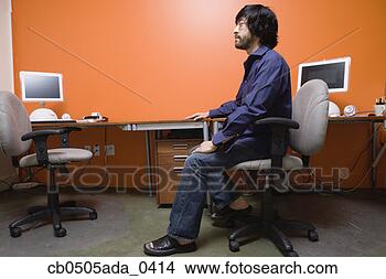 Stock Photo - man sitting at 
desk. fotosearch 
- search stock 
photos, pictures, 
images, and photo 
clipart