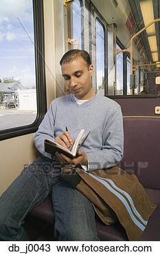Stock Photo - man writing in 
day timer on subway. 
fotosearch - search 
stock photos, 
pictures, images, 
and photo clipart