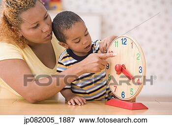 Picture - mother teaching 
son to tell time. 
fotosearch - search 
stock photos, 
pictures, images, 
and photo clipart