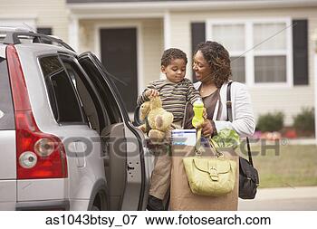 Picture - mother unloading 
son and groceries 
from van. fotosearch 
- search stock 
photos, pictures, 
images, and photo 
clipart