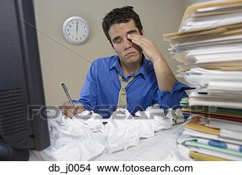 Stock Photo - overwhelmed businessman 
at desk with piles 
of paper. fotosearch 
- search stock 
photos, pictures, 
images, and photo 
clipart