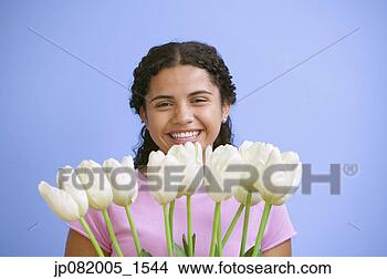 Stock Photo - portrait of teenage 
girl with tulips. 
fotosearch - search 
stock photos, 
pictures, images, 
and photo clipart